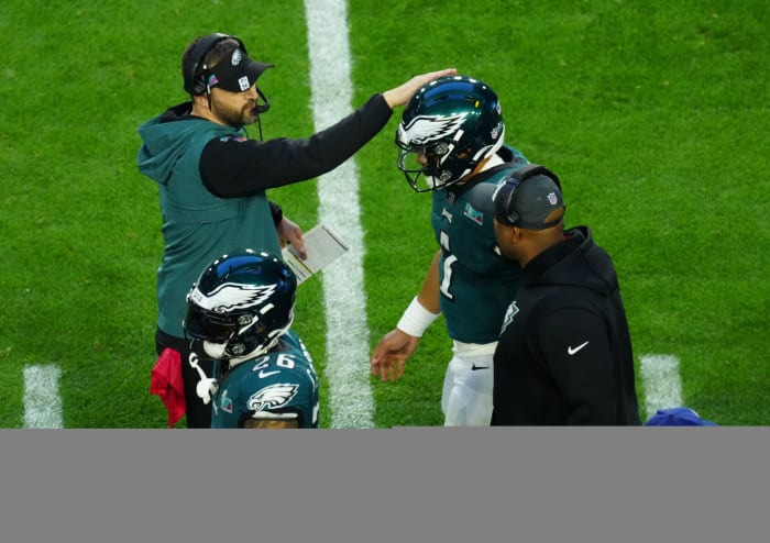 Philadelphia Eagles quarterback Jalen Hurts (1) celebrates with Philadelphia Eagles head coach Nick Sirianni after scoring a touchdown against the Kansas City Chiefs during the first half of the Super Bowl.